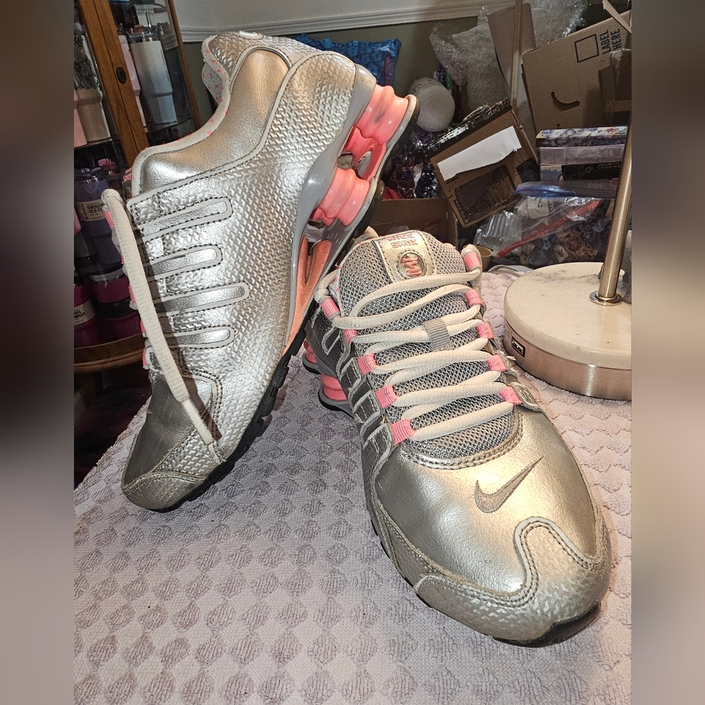 Nike Silver and Pink Sneakers with Rounded Toe and Streamlined Design